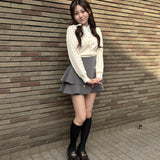 レイヤードケーブルニット