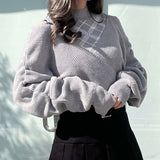 シャーリング袖カシュクールニット